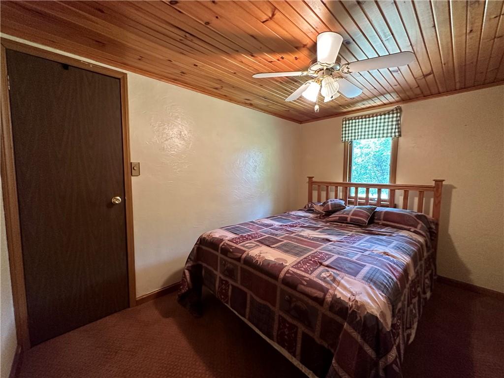 175 Fair Road Indiana, PA 15701 - Photo 12 of 21 a bedroom with a bed and a chandelier