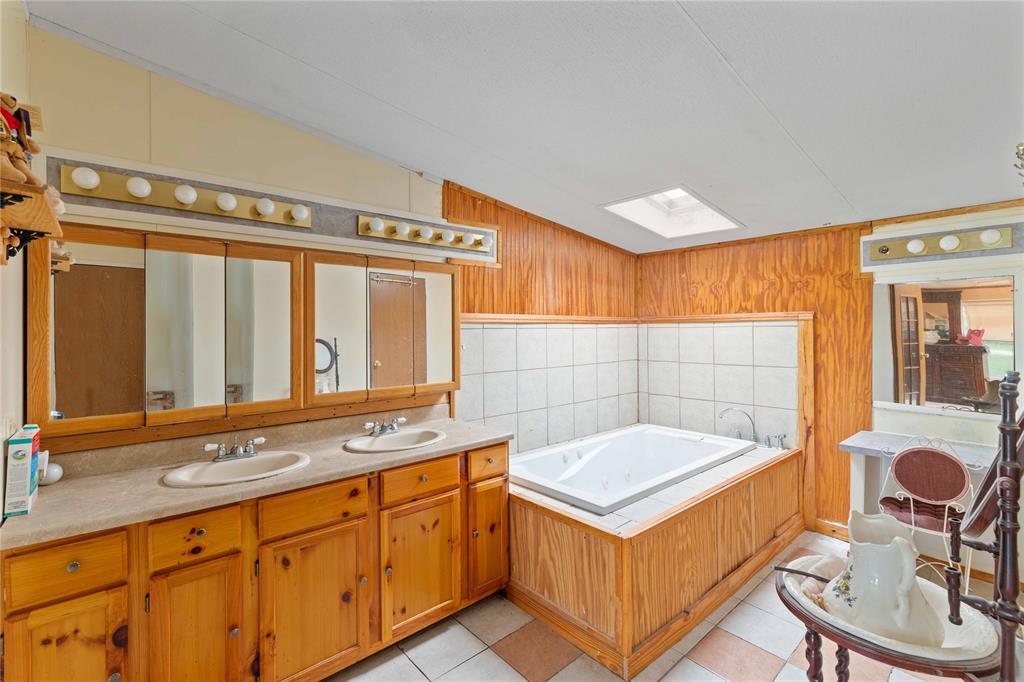 210 7th Street Blanket, TX 76432 - Photo 18 of 33 a bathroom with a sink and a bathtub