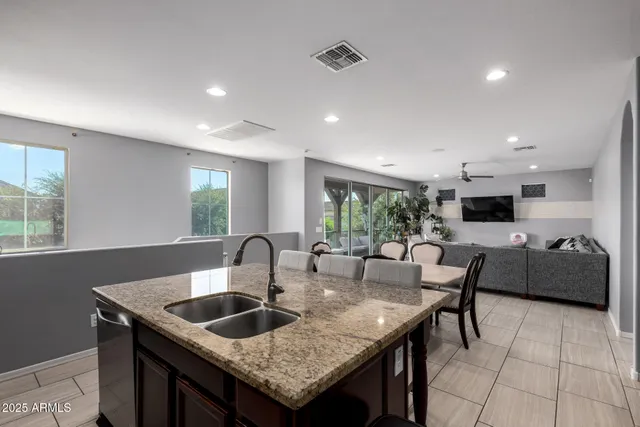 a kitchen with granite countertop a counter top space and a sink