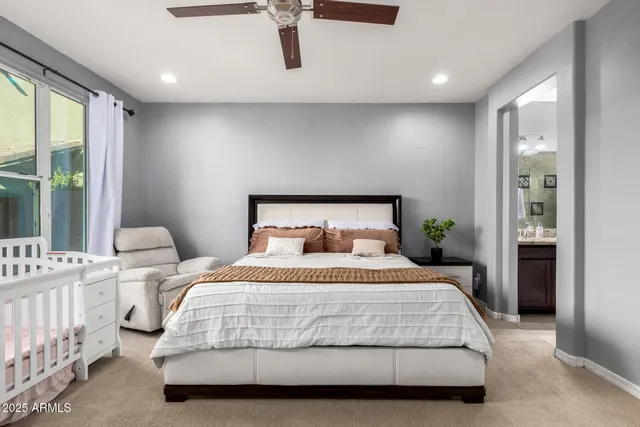 a bedroom with a bed and window