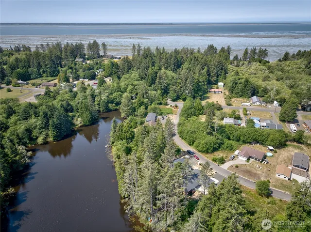 a view of a lake with beach and outdoor space