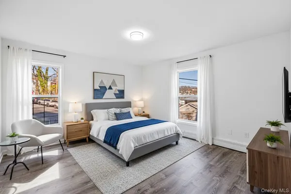 a bedroom with a bed and a chair