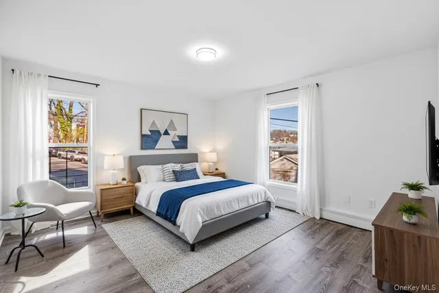 a bedroom with a bed and a chair