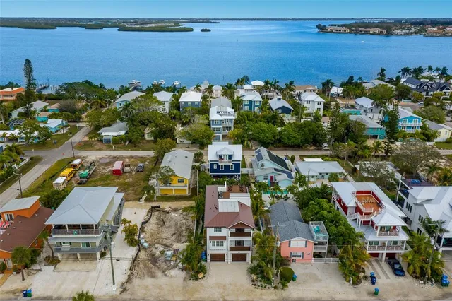 a kitchen with stainless steel appliances a sink a stove and a refrigerator