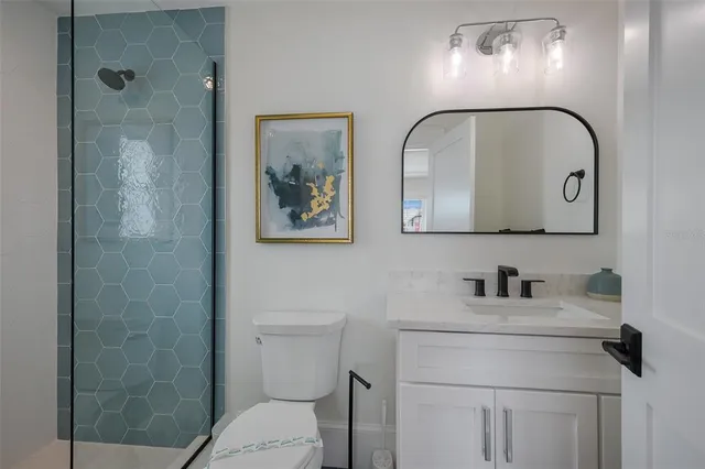 a bedroom with a large bed and a large window