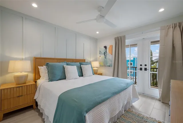 a kitchen with a wooden floor and cabinets