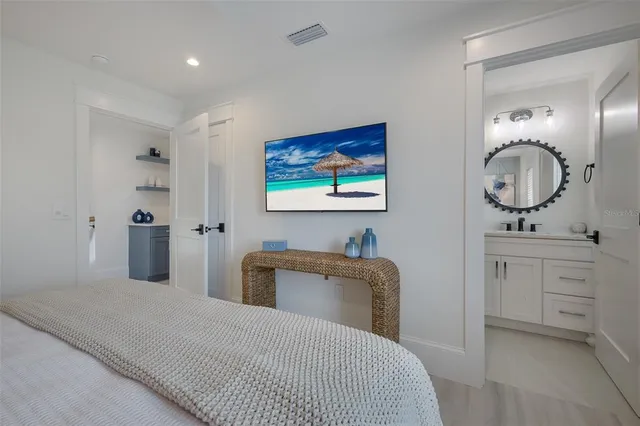 a bedroom with two beds and a large window