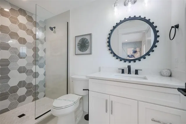 a bedroom with a bed and a painting