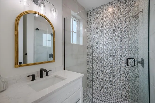 a bathroom with a toilet a sink and a mirror