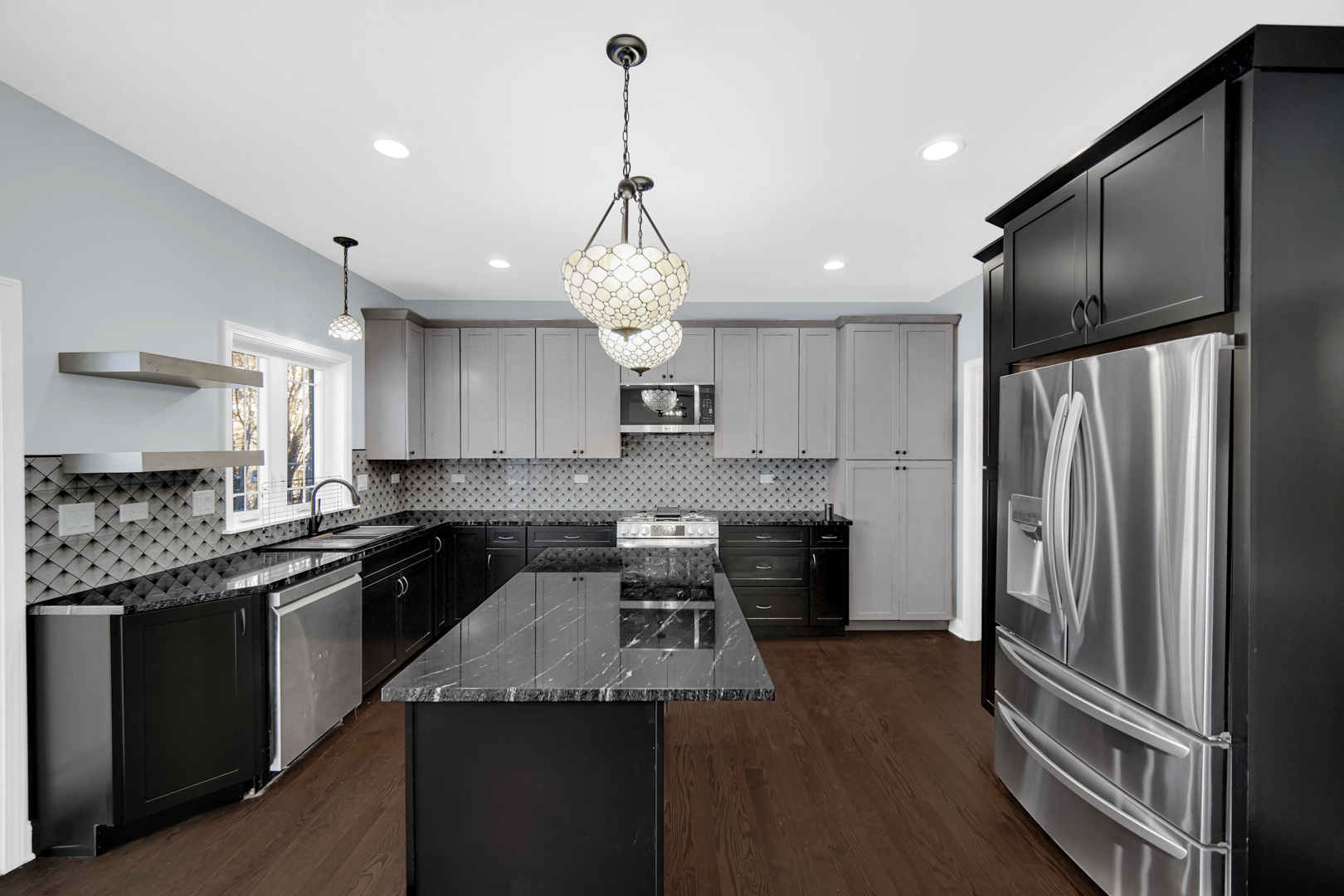 6532 West 112th Street Worth, IL 60482 - Photo 11 of 27 a kitchen with stainless steel appliances granite countertop a refrigerator a sink dishwasher a stove and white cabinets with wooden floor