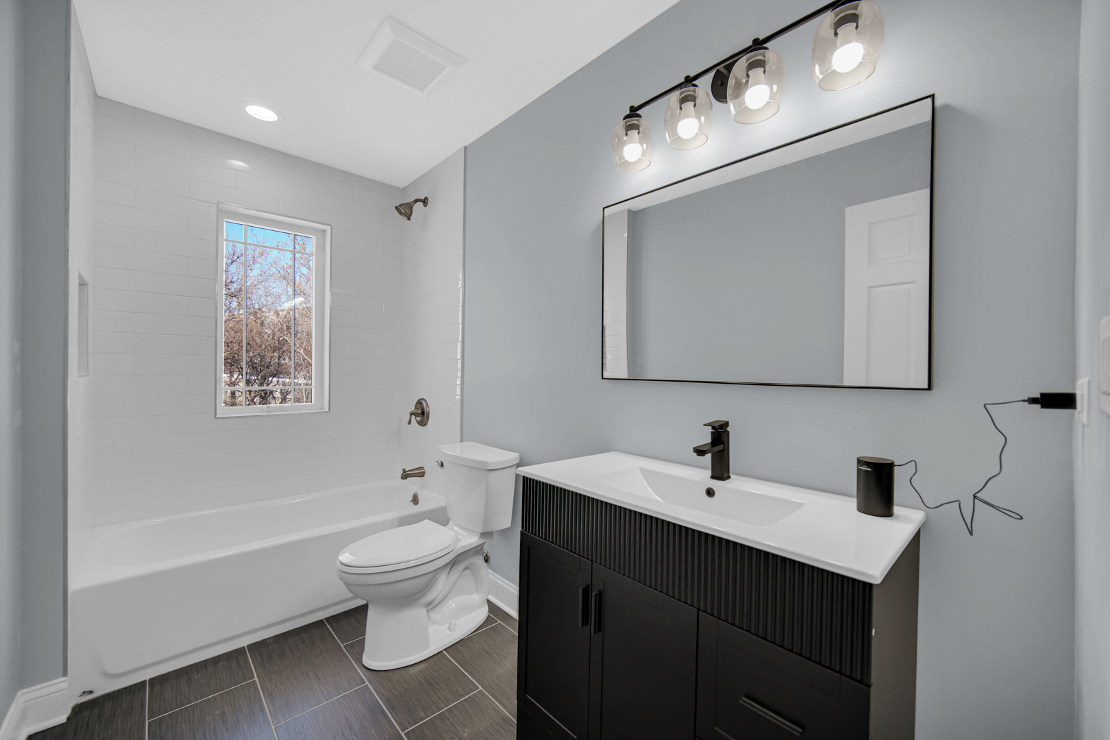 6532 West 112th Street Worth, IL 60482 - Photo 19 of 27 a bathroom with a toilet sink and mirror