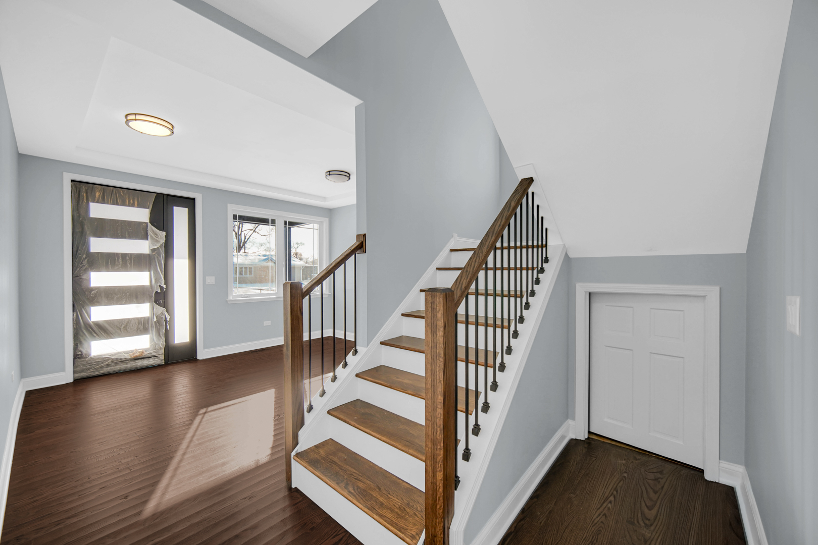 6532 West 112th Street Worth, IL 60482 - Photo 5 of 27 a view of front door with hallway and wooden floor