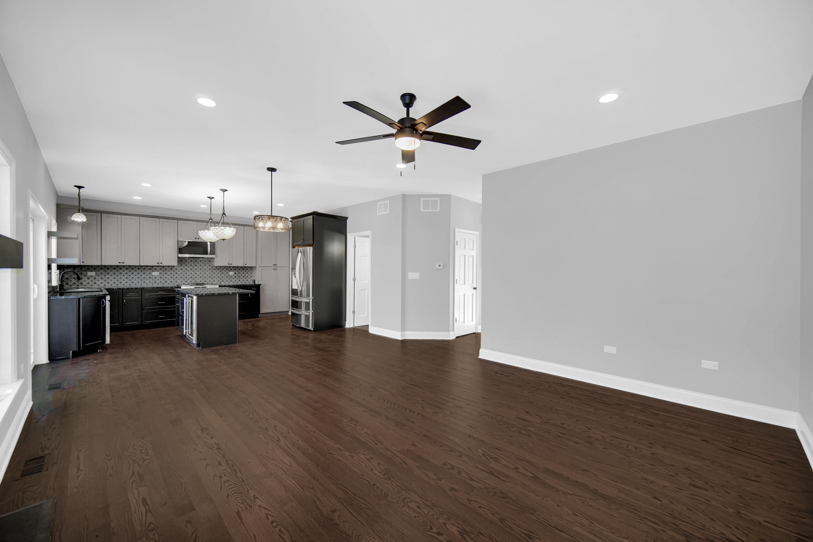6532 West 112th Street Worth, IL 60482 - Photo 6 of 27 a view of a kitchen with a stove cabinets and wooden floor