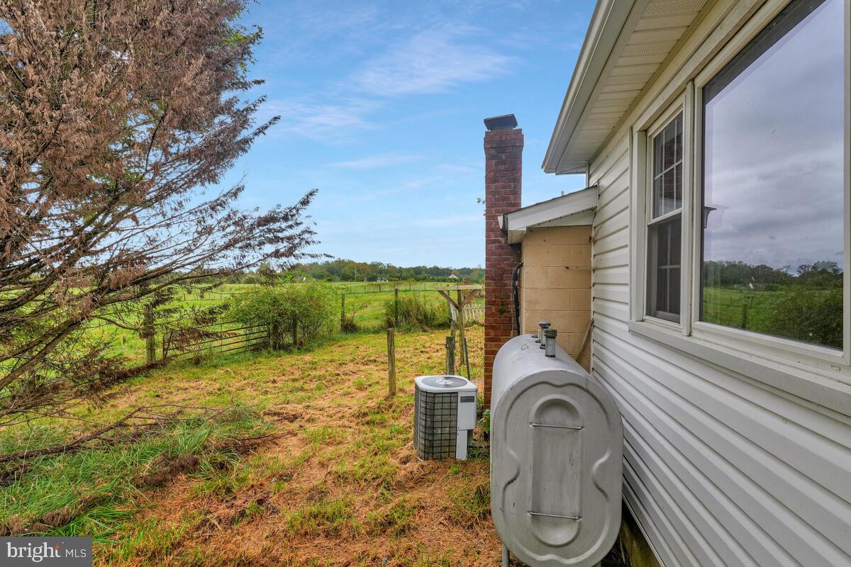 38888 Reeves Road Mechanicsville, MD 20659 - Photo 11 of 50 a view of a balcony with floor to ceiling windows with wooden floor