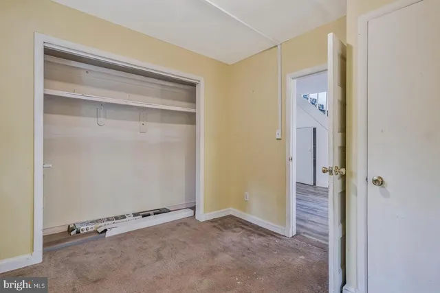 a kitchen with a sink cabinets stainless steel appliances and a window