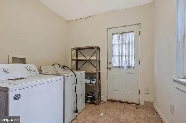 a kitchen with stainless steel appliances a refrigerator and a stove top oven