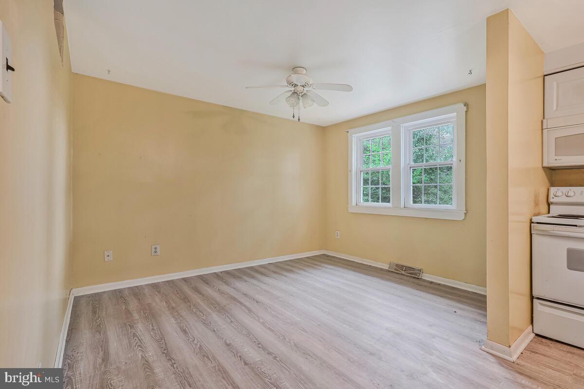 38888 Reeves Road Mechanicsville, MD 20659 - Photo 23 of 50 wooden floor in an empty room with a window