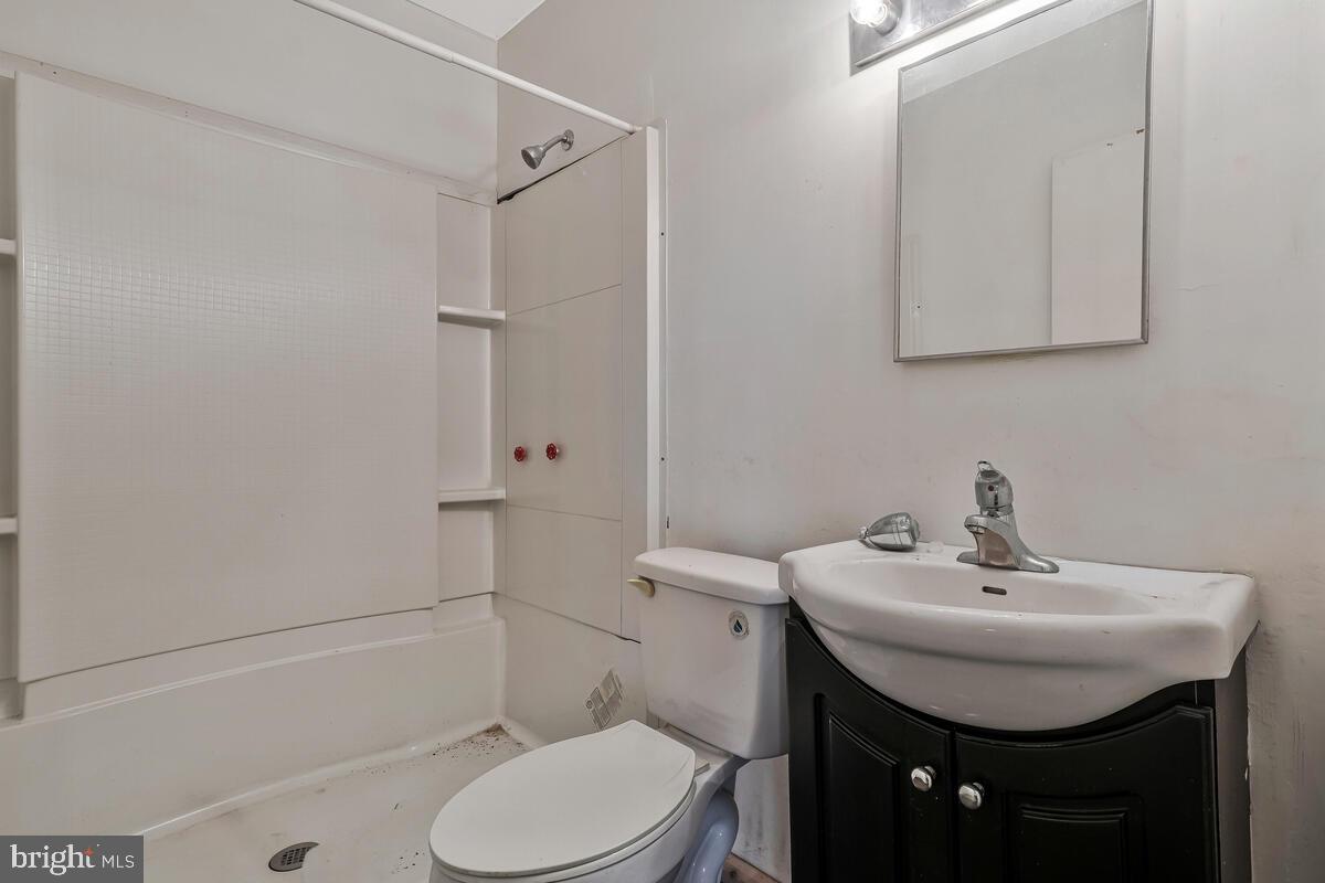 38888 Reeves Road Mechanicsville, MD 20659 - Photo 32 of 50 a bathroom with a sink a toilet and shower