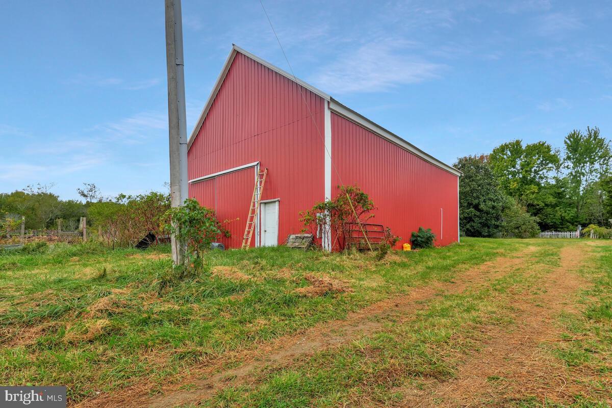 38888 Reeves Road Mechanicsville, MD 20659 - Photo 44 of 50 a backyard of a house with lots of green space