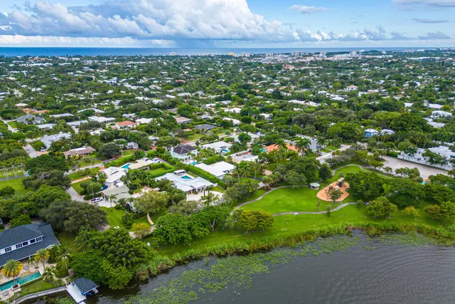 a view of a pool patio fire pit and outdoor kitchen