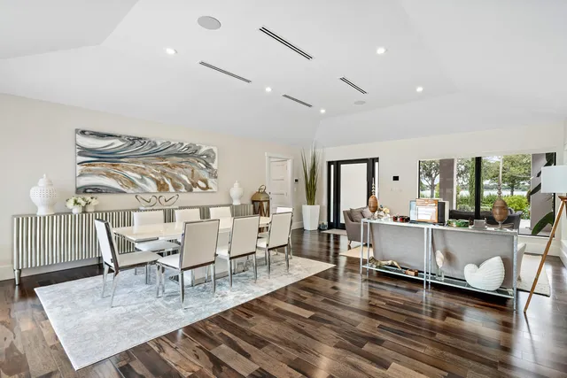 a dining room with furniture and wooden floor
