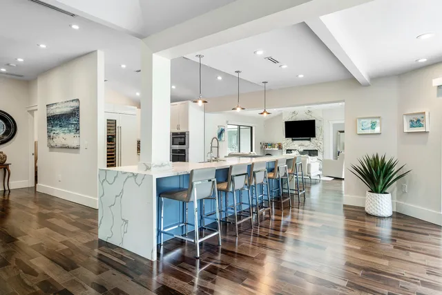 a kitchen with stainless steel appliances a stove microwave and refrigerator