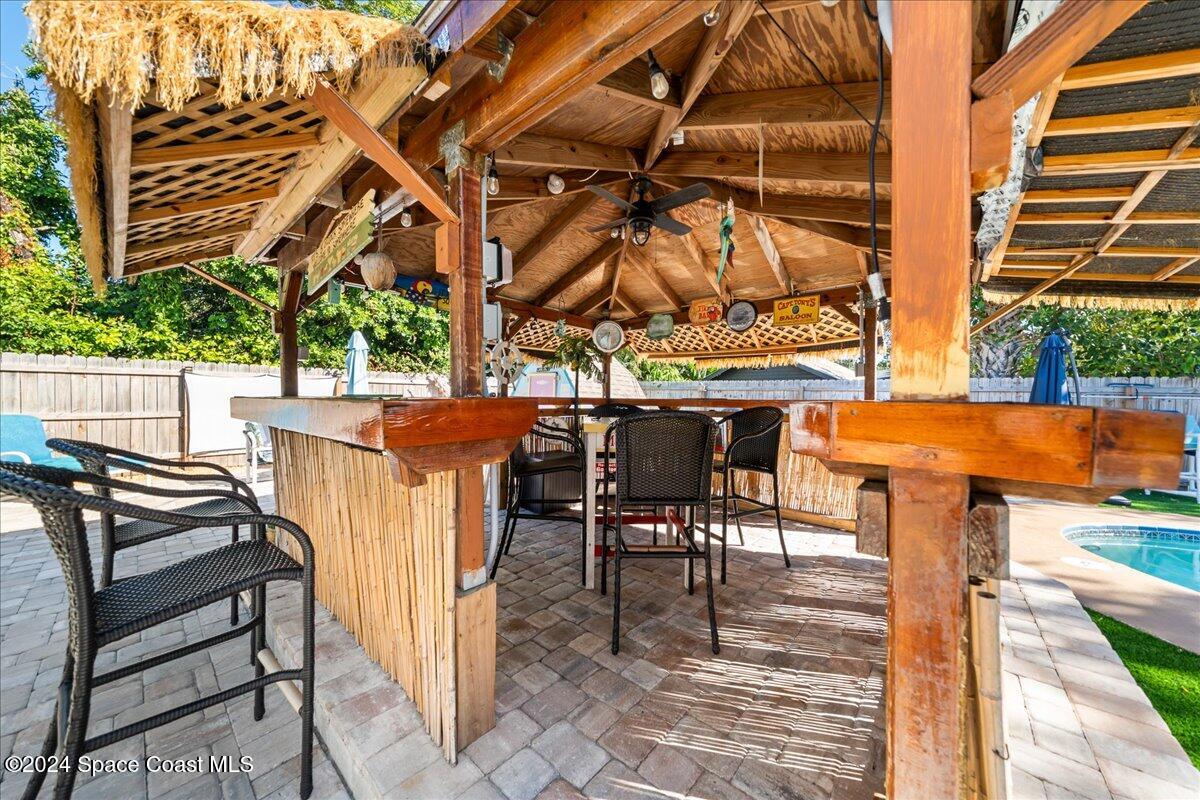 1509 Hedrick Drive Melbourne, FL 32901 - Photo 4 of 20 a view of a patio with a table and chairs
