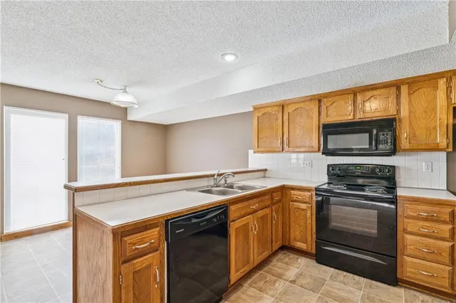 $235,000 | 703 Northeast Swann Circle, Lee's Summit, MO 64086