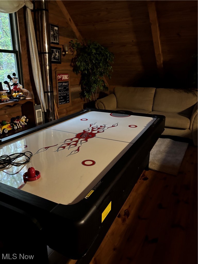 55249 Jim Ball Road Senecaville, OH 43780 - Photo 11 of 14 Game room with dark wood-style flooring and wood walls