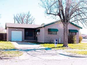 4317 South Bonham Street Amarillo, TX 79110 - Photo 1 of 1 a view of a house with a swimming pool and a yard