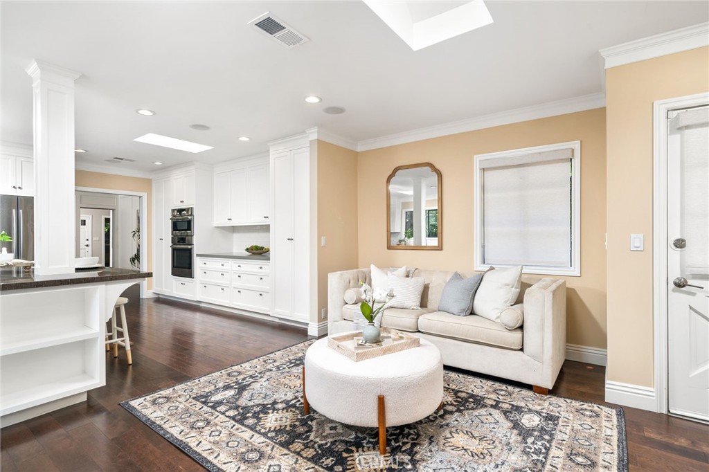 3343 San Pasqual Street Pasadena, CA 91107 - Photo 14 of 45 a living room with kitchen island furniture and a wooden floor