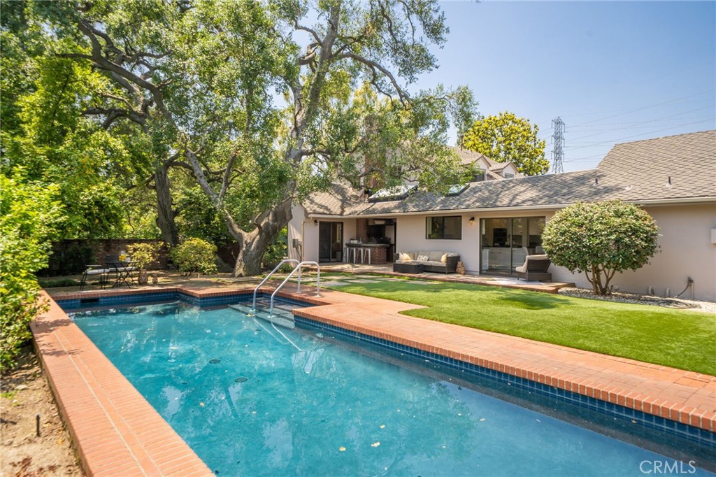 3343 San Pasqual Street Pasadena, CA 91107 - Photo 35 of 45 a view of a house with swimming pool and a yard