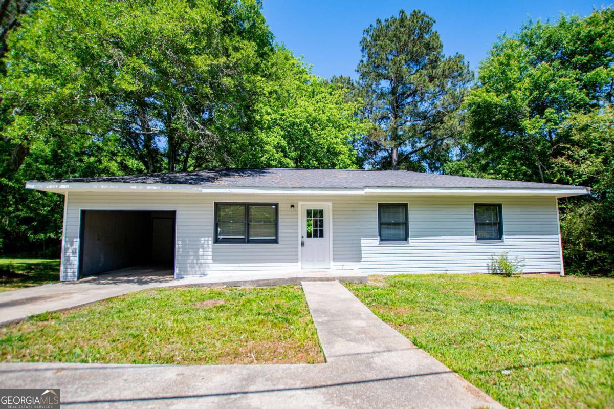 801 Bowdon Tyus Road Bowdon, GA 30108 - Photo 2 of 62 a house view with a outdoor space