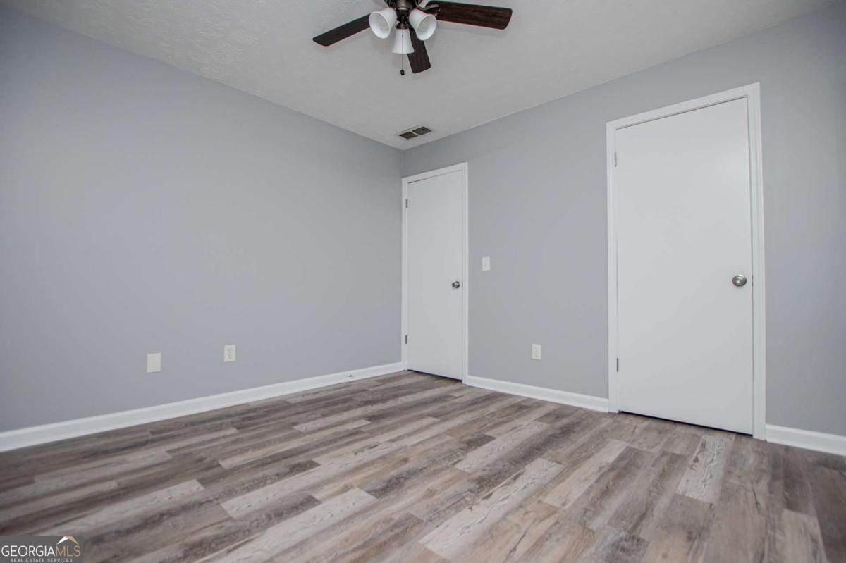 801 Bowdon Tyus Road Bowdon, GA 30108 - Photo 23 of 62 wooden floor in an empty room