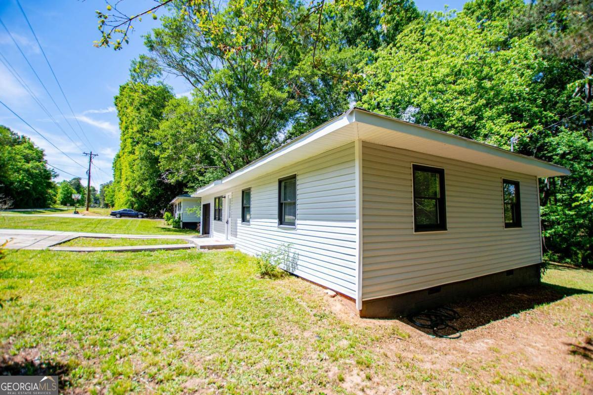 801 Bowdon Tyus Road Bowdon, GA 30108 - Photo 4 of 62 a view of a house with a yard