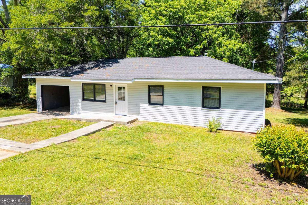 801 Bowdon Tyus Road Bowdon, GA 30108 - Photo 47 of 62 a house view with a swimming pool