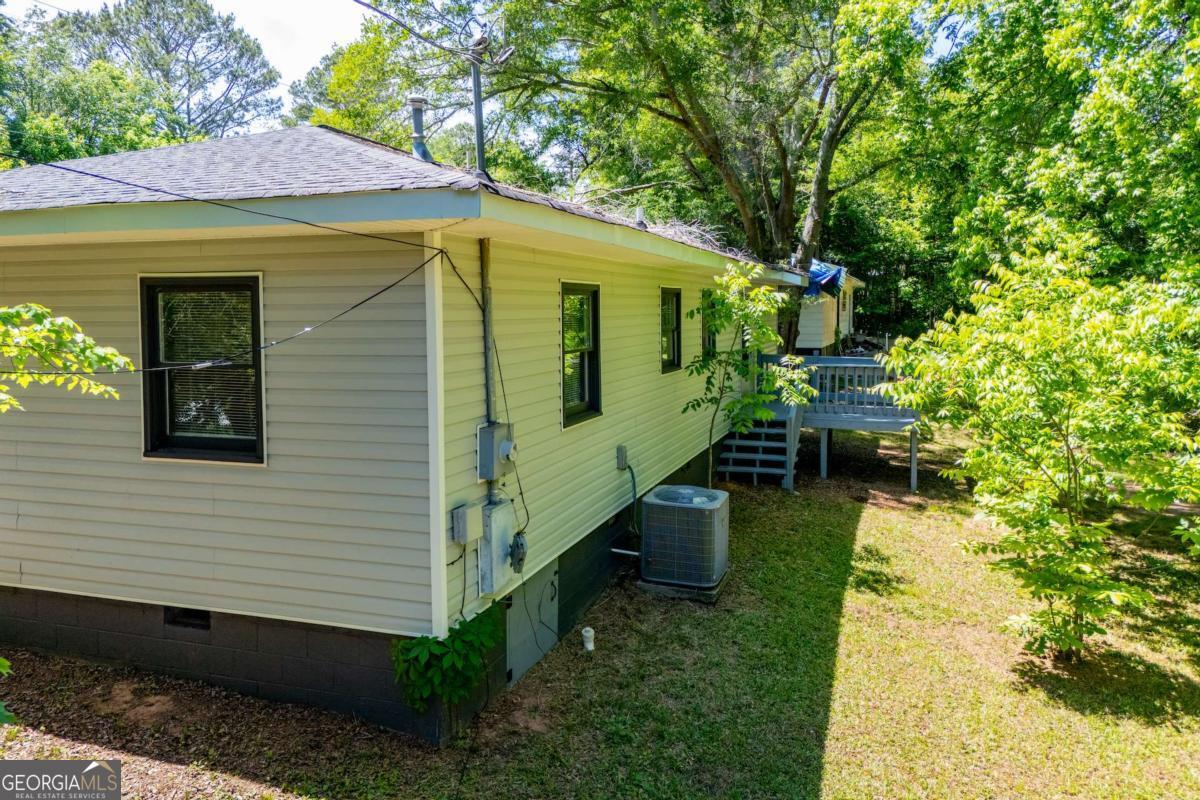 801 Bowdon Tyus Road Bowdon, GA 30108 - Photo 55 of 62 a view of a small house with a yard