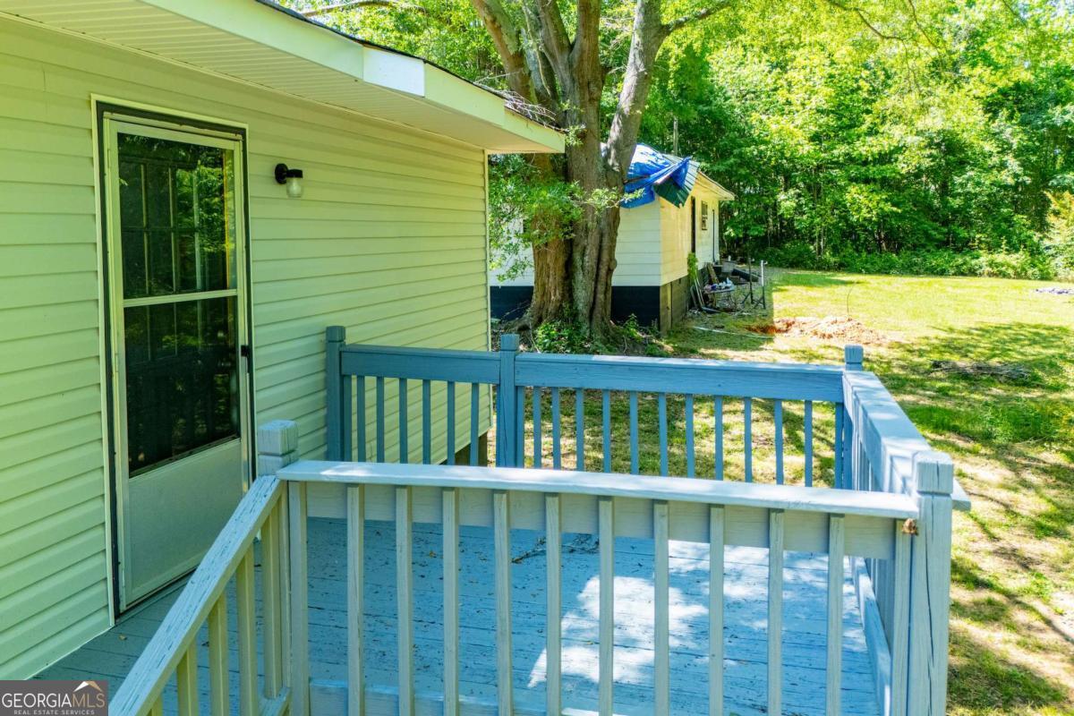 801 Bowdon Tyus Road Bowdon, GA 30108 - Photo 58 of 62 a view of a small yard from a balcony