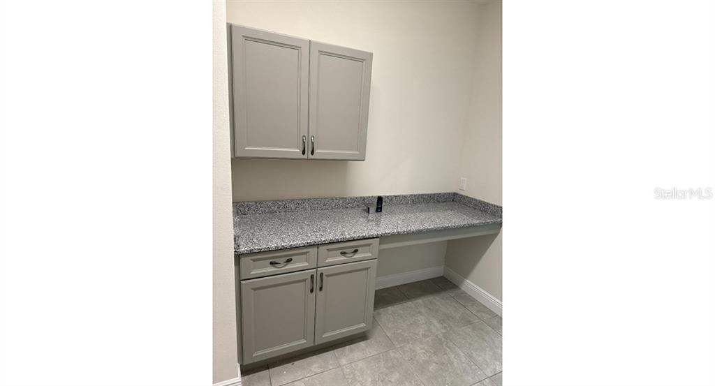 2573 Tulsa Avenue North Port, FL 34286 - Photo 5 of 11 a kitchen with a sink and cabinets