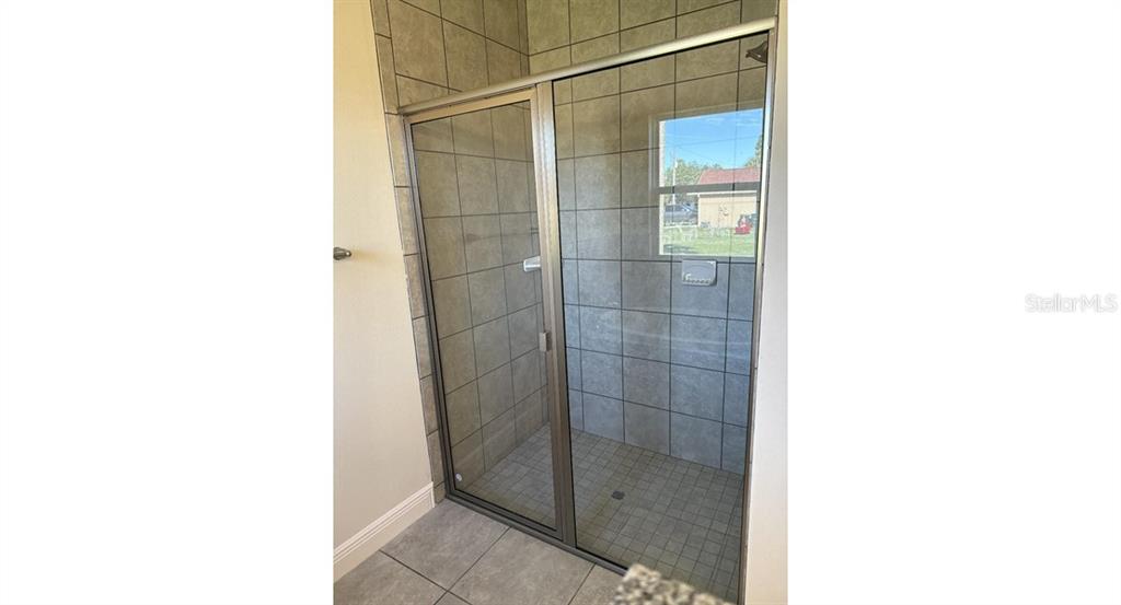 2573 Tulsa Avenue North Port, FL 34286 - Photo 9 of 11 a bathroom with a shower and a sink