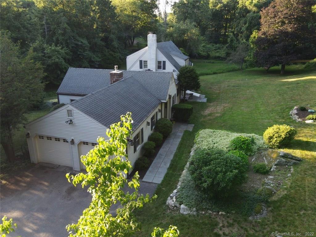 a aerial view of a house with a yard patio and garden