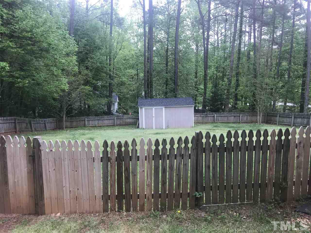 1534 Middle Ridge Drive Willow Spring, NC 27592 - Photo 12 of 23 Smaller of 2 storage sheds in fenced part of yard. Note: the yard goes past the fence almost to the neighbor's driveway. Both sheds being sold in "as is" condition.
