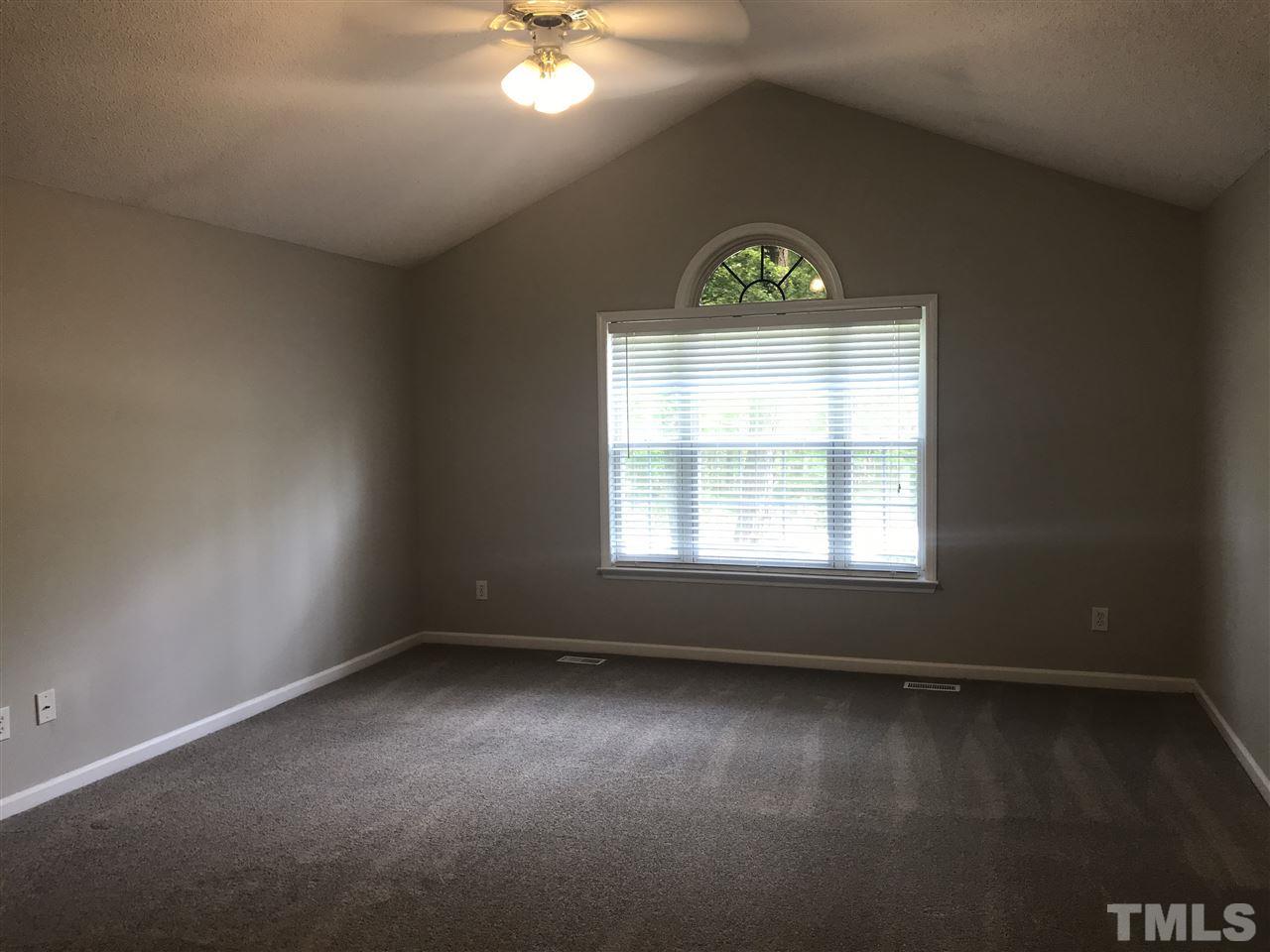 1534 Middle Ridge Drive Willow Spring, NC 27592 - Photo 13 of 23 Huge master bedroom with vaulted ceiling, ceiling fan/light and new carpet. Large walk-in closet.