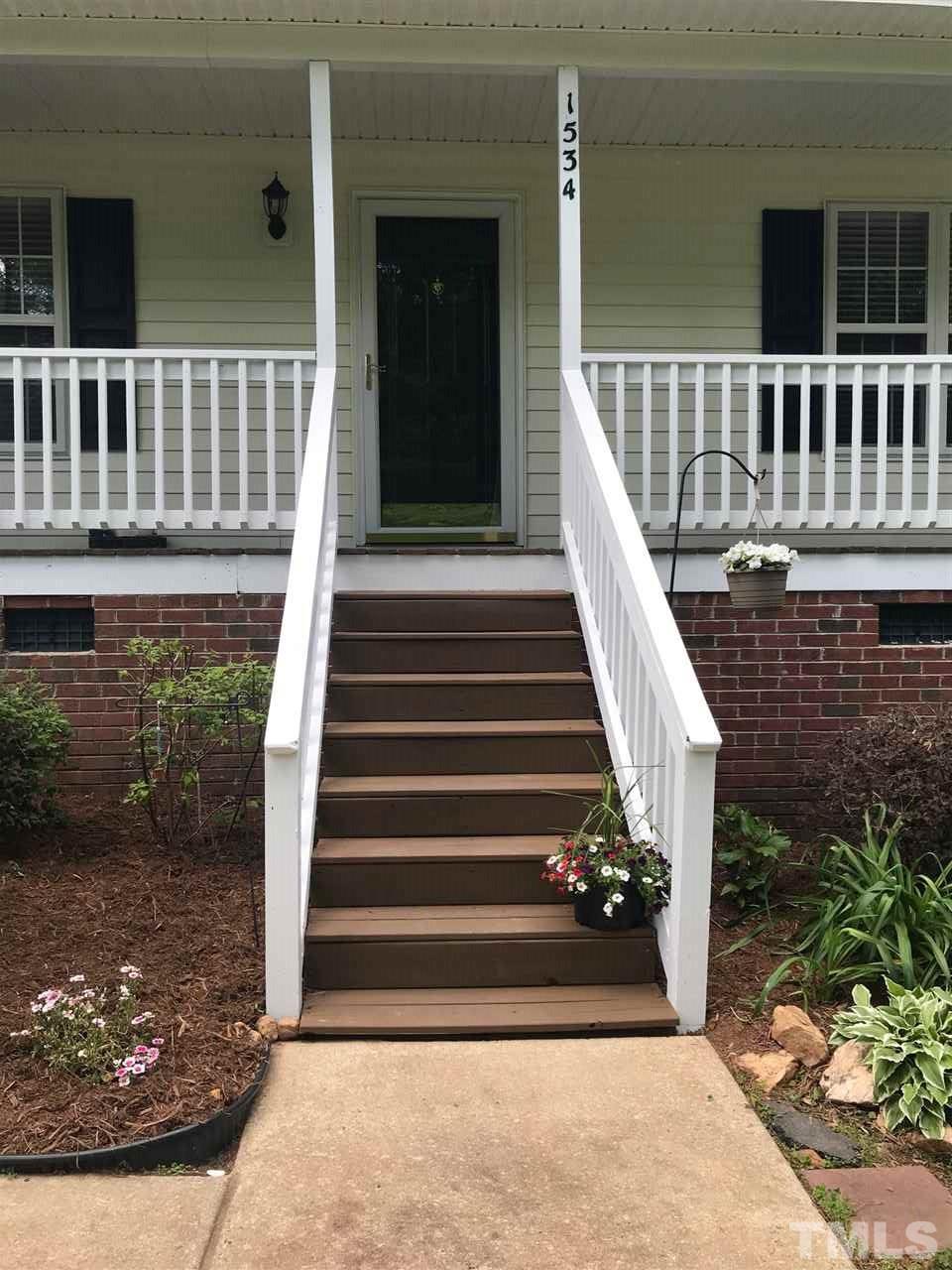 1534 Middle Ridge Drive Willow Spring, NC 27592 - Photo 21 of 23 Relax on the covered front porch!