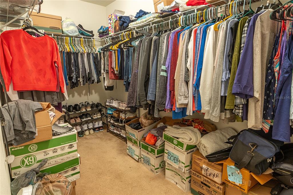 4563 Orchard Grove Road St. Cloud, FL 34772 - Photo 25 of 51 a view of walk in closet with clothes
