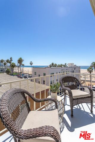 a view of a balcony with furniture and city view