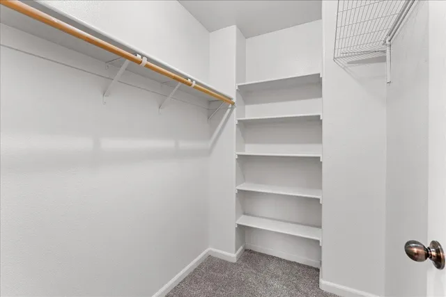 a view of an empty walk in closet