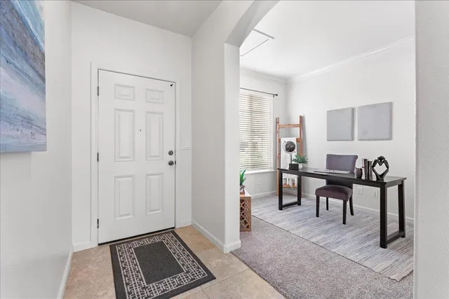 a view of a livingroom with furniture and windows