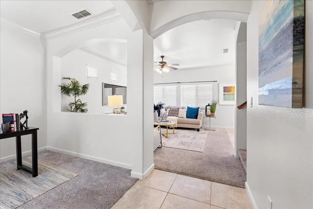 a living room with furniture and a table