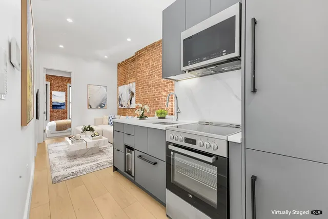 a kitchen with a stove and a microwave